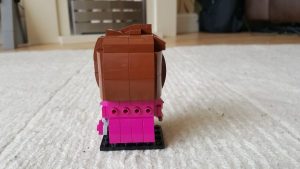 The back of a Lego Brickheadz style representation of Dolores Umbridge